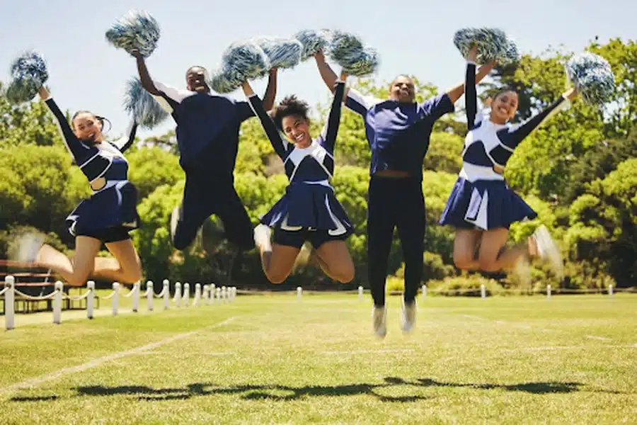 Cheerleaders jumping in the air.