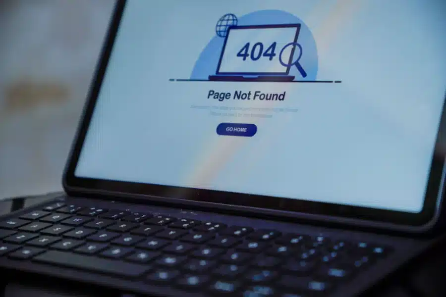 Laptop screen showing a 404 error page not found message, symbolizing why an inmate is not showing up in search results.